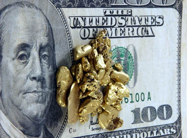 Gold And Hundred Dollar Bill